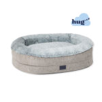 Round dog bed with raised walls, plush faux fur in a light grey colour artic and hugzzz filling