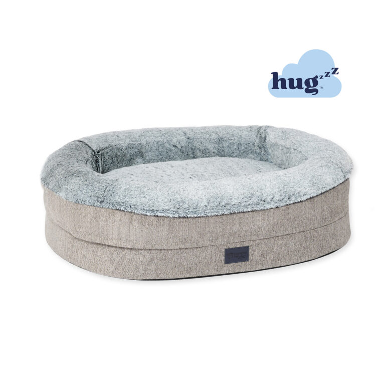 Round dog bed with raised walls, plush faux fur in a light grey colour artic and hugzzz filling