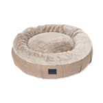 Round dog bed with raised walls and faux fur calming lining in light brown puppachino colour
