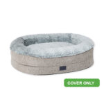 Large grey dog bed with raised sides and plush faux fur lining. Replaceable cover
