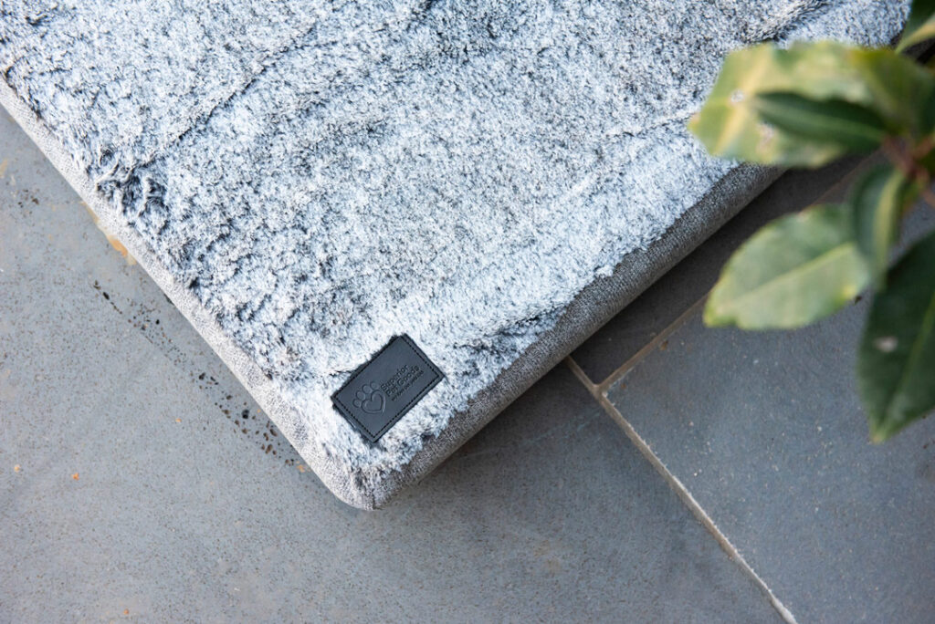 Corner of Superior Pet Goods water resistant ortho dog mat in Artic fur